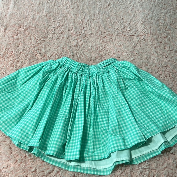 This is a turquoise green skirt for girls by Carter’s. The size is US 8. - Picture 2 of 2